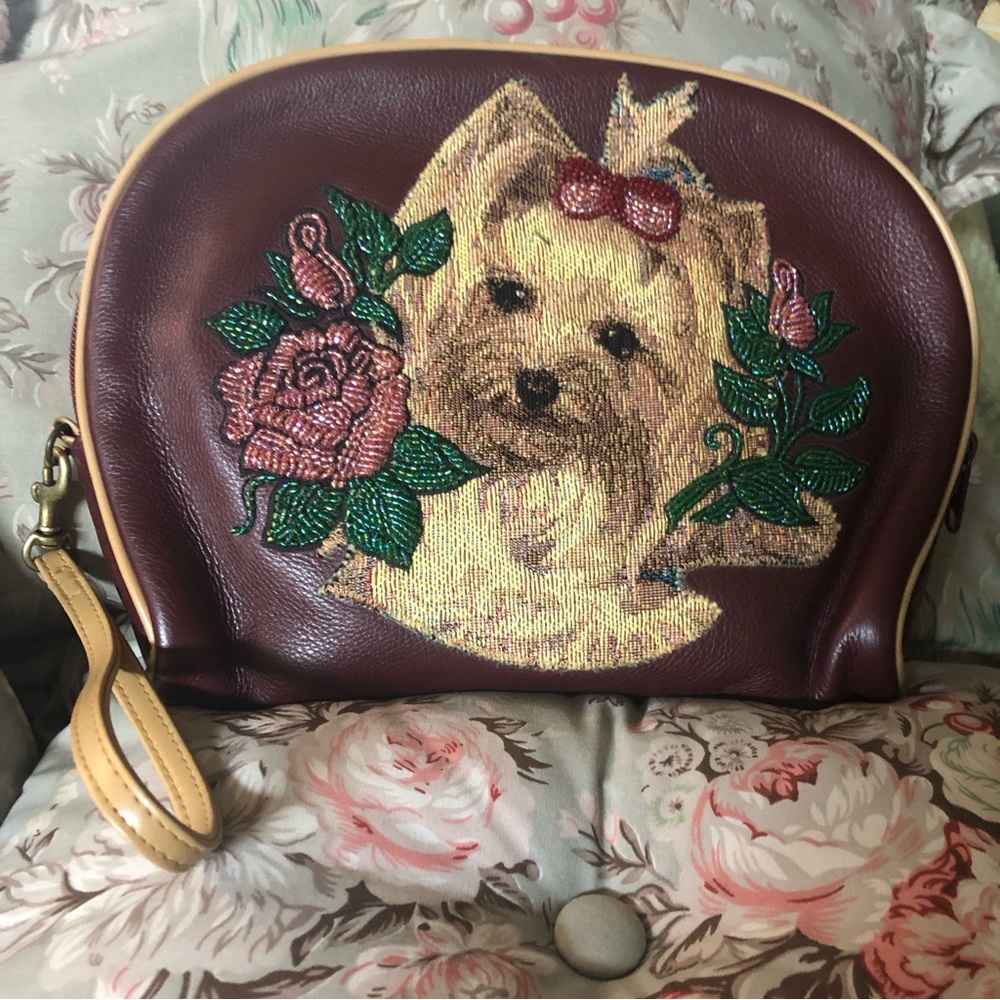 Large Dome shaped Isabella Fiore wristlet/makeup bag.